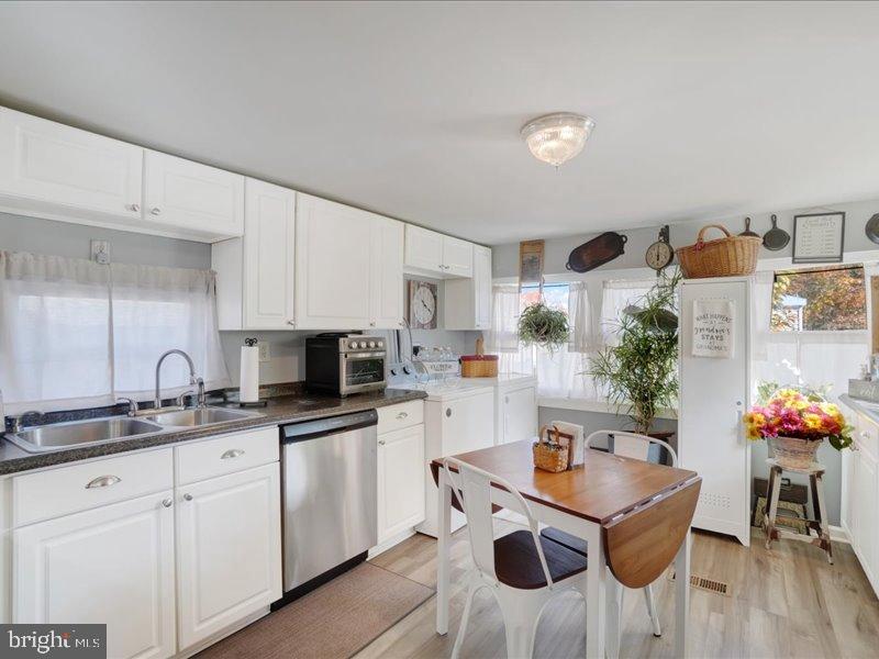 143 Pawnee Avenue Dover, PA 17315 - Photo 4 of 23 a kitchen with stainless steel appliances kitchen island granite countertop a sink and cabinets