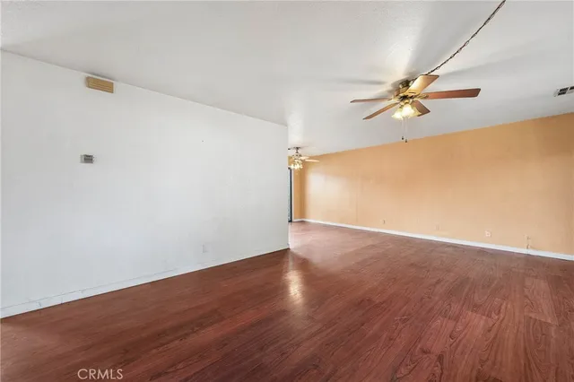 a view of a big room with wooden floor