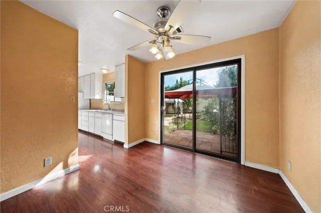 a view of an entryway with wooden floor