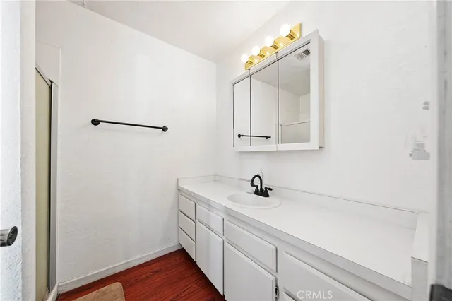 a bathroom with a sink and mirror