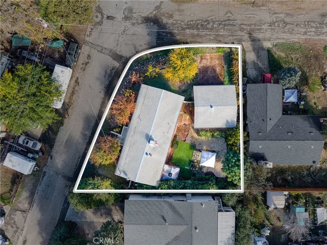 an aerial view of a house with a swimming pool