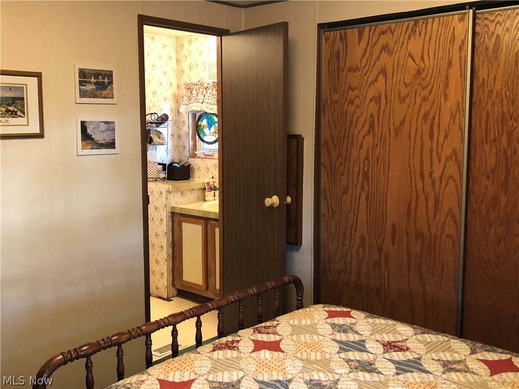1600 North Buck Road, Unit 98 Lakeside Marblehead, OH 43440 - Photo 23 of 32 Master bedroom with full bathroom.