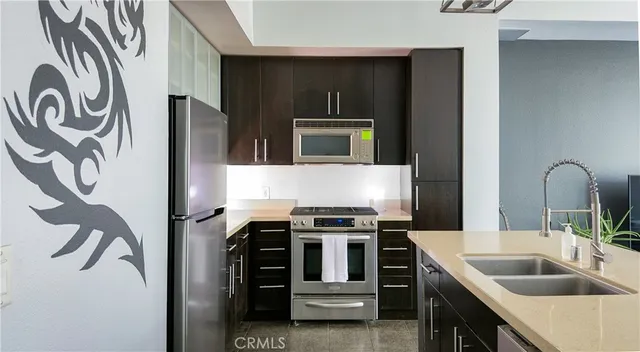 a living room with fireplace furniture and a flat screen tv