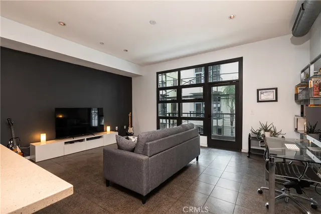 a bathroom with a double vanity sink a toilet and shower