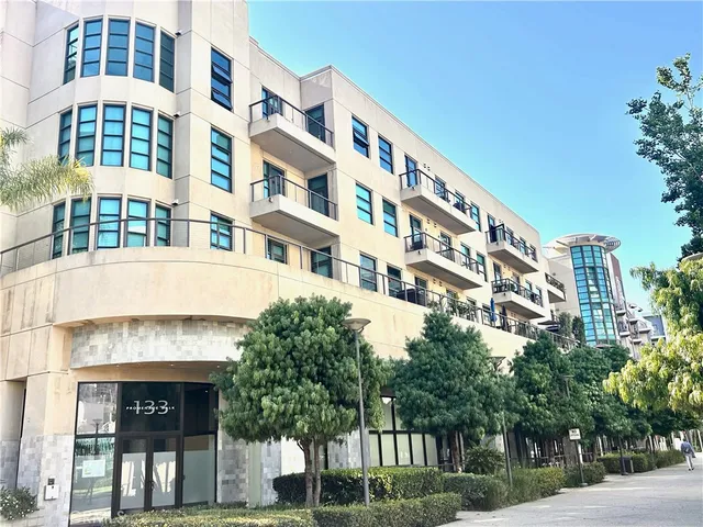 a front view of a building with parking