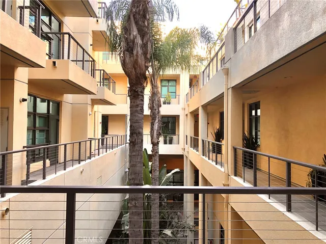 a porch with a table and chairs