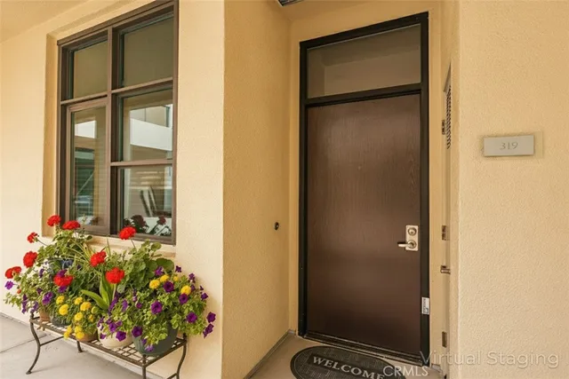 a living room with furniture a flat screen tv and a large window