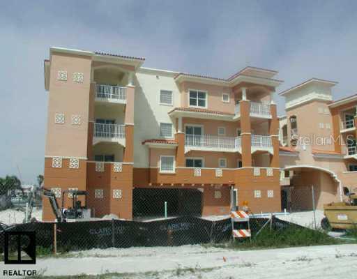 650 P Inellas, Unit 5302 St. Petersburg, FL 33715 - Photo 1 of 1 a front view of a building with windows