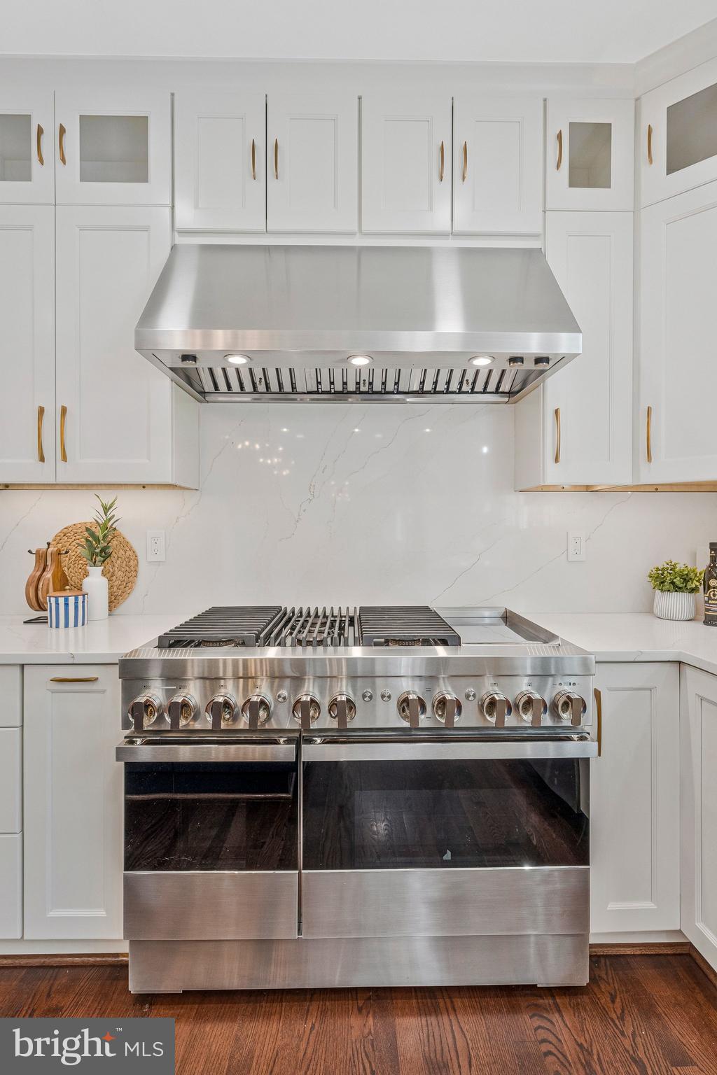 8611 Brook Road McLean, VA 22102 - Photo 21 of 104 a stove top oven sitting inside of a kitchen