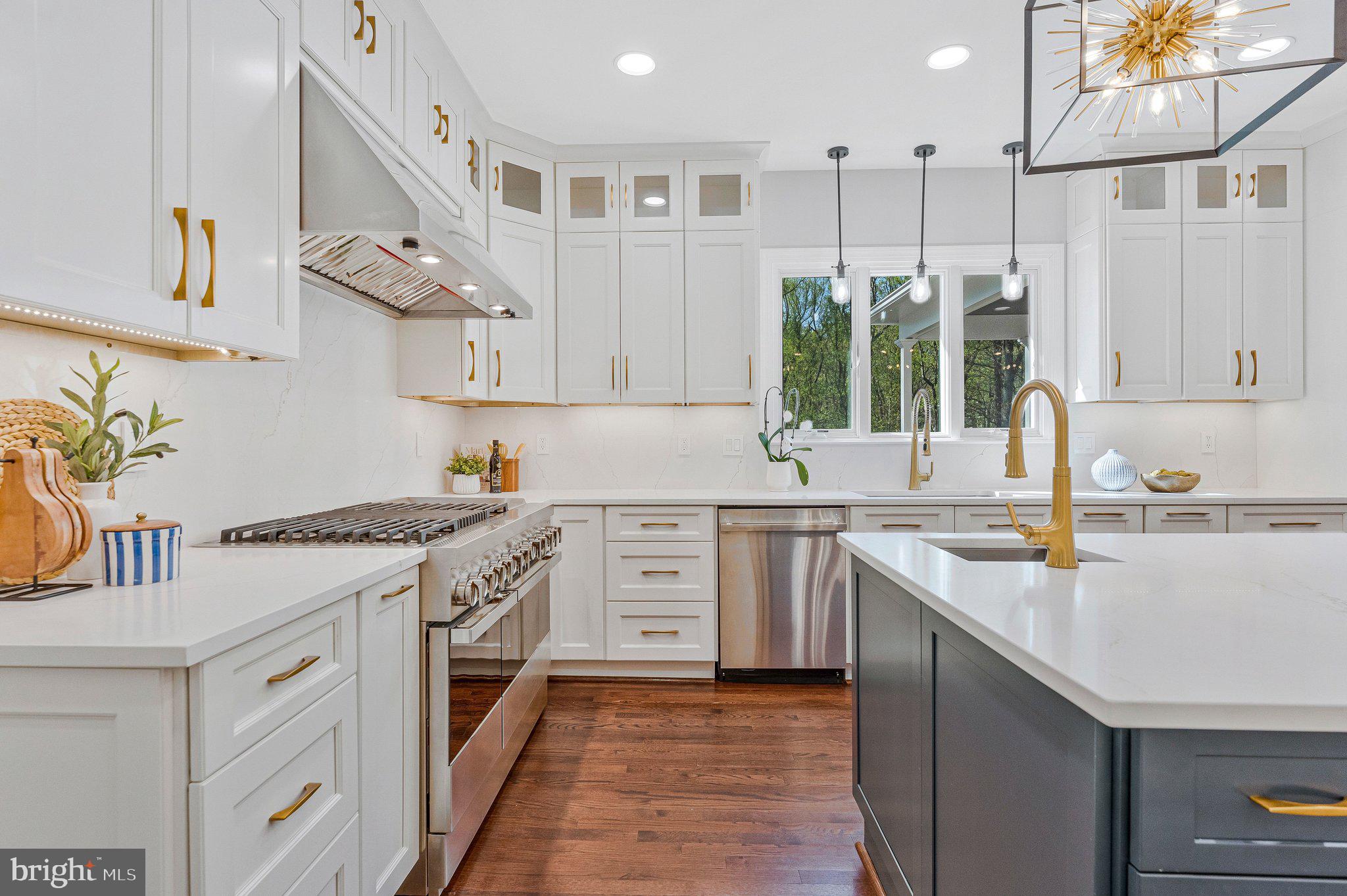 8611 Brook Road McLean, VA 22102 - Photo 23 of 104 a kitchen with a stove a sink and a refrigerator