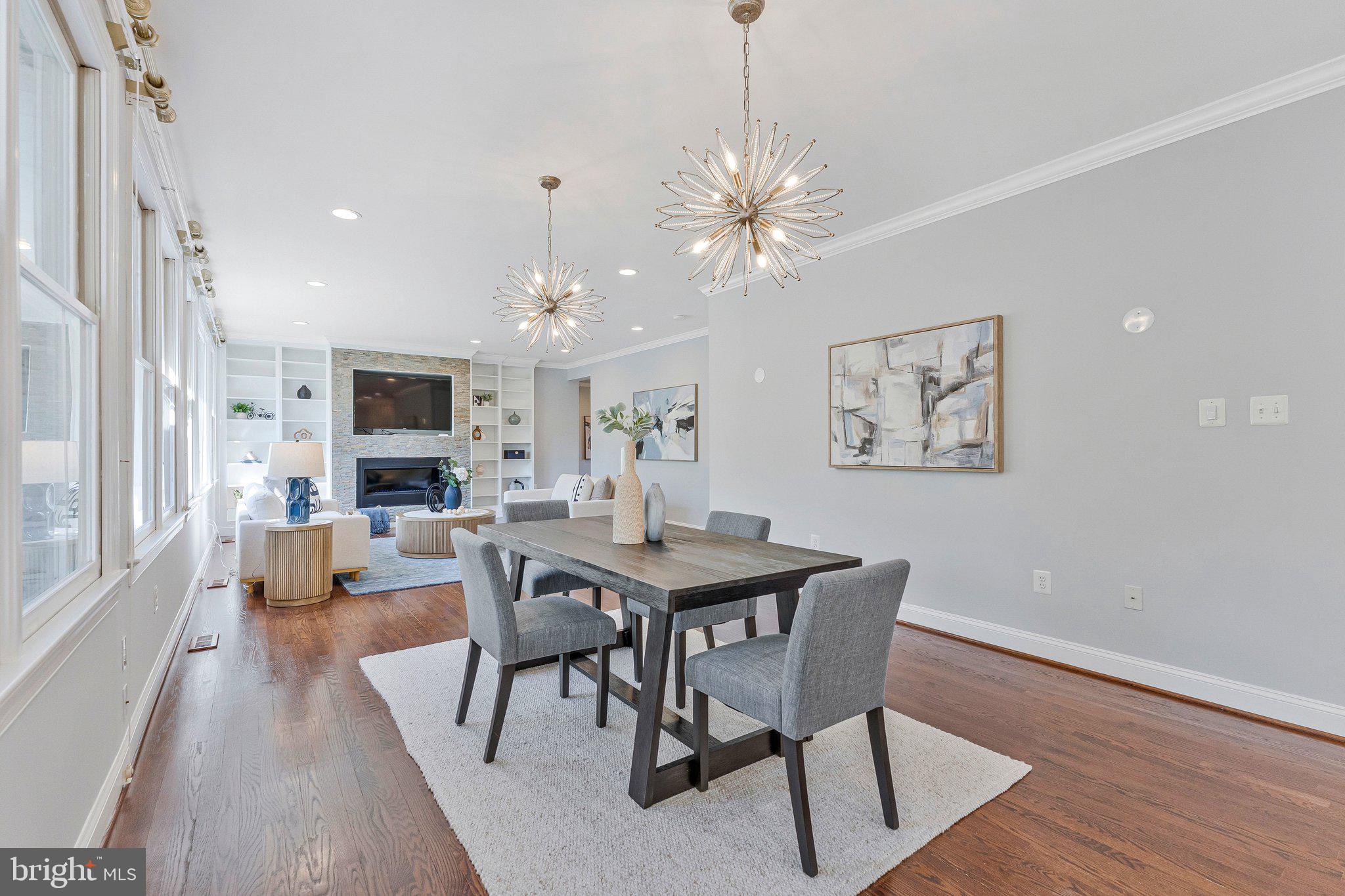 8611 Brook Road McLean, VA 22102 - Photo 29 of 104 a view of a dining room with furniture a chandelier and wooden floor