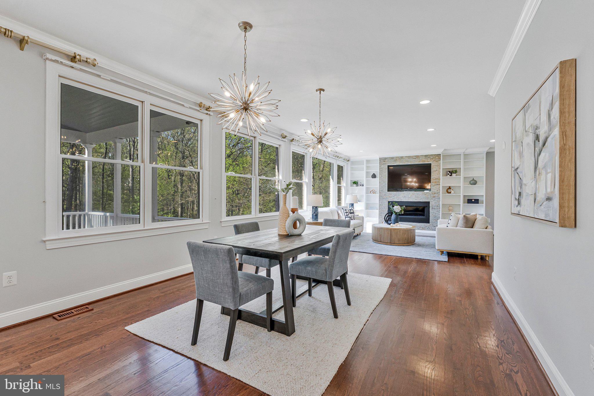 8611 Brook Road McLean, VA 22102 - Photo 31 of 104 a view of a dining room with furniture window and wooden floor