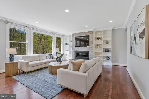 a bed room with a bed a couch and a window