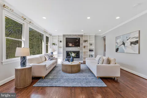 a view of a livingroom with furniture and a window