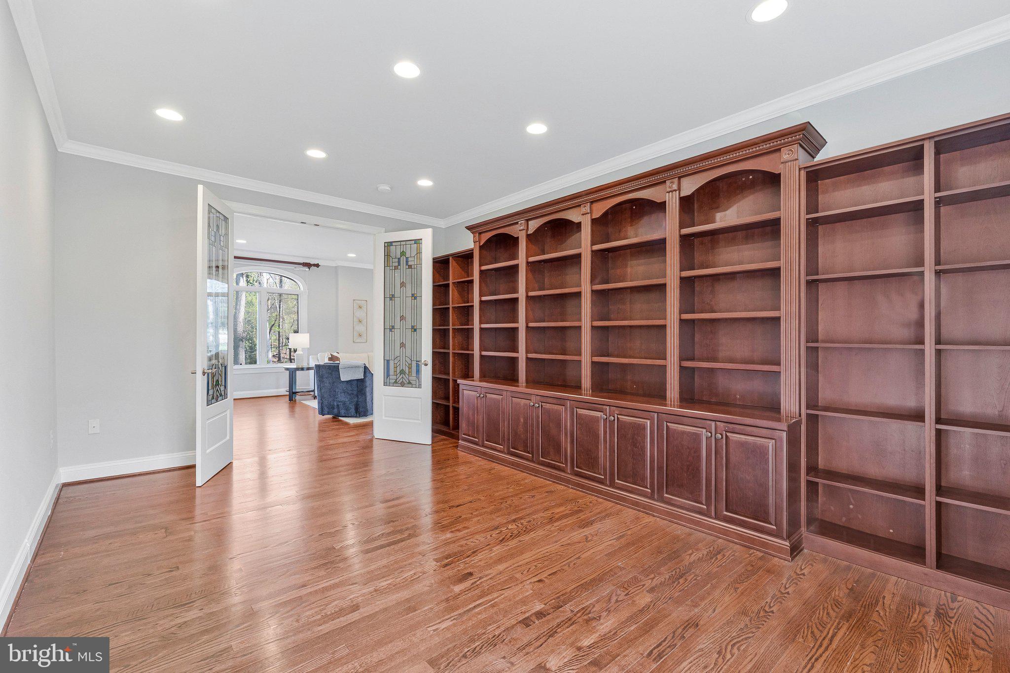 8611 Brook Road McLean, VA 22102 - Photo 40 of 104 a view of an empty room with wooden floor and a window