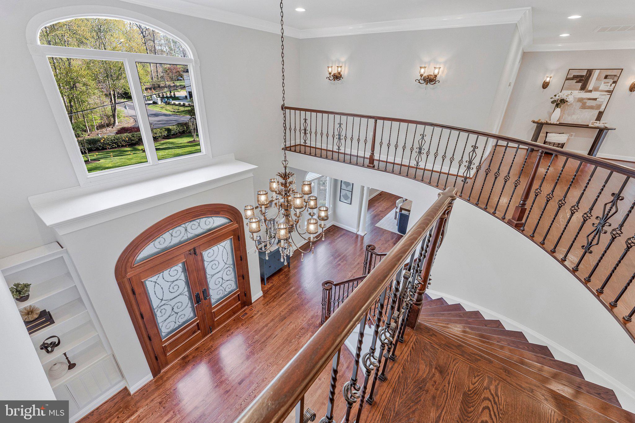 8611 Brook Road McLean, VA 22102 - Photo 43 of 104 a view of an entryway wooden floor and dining room
