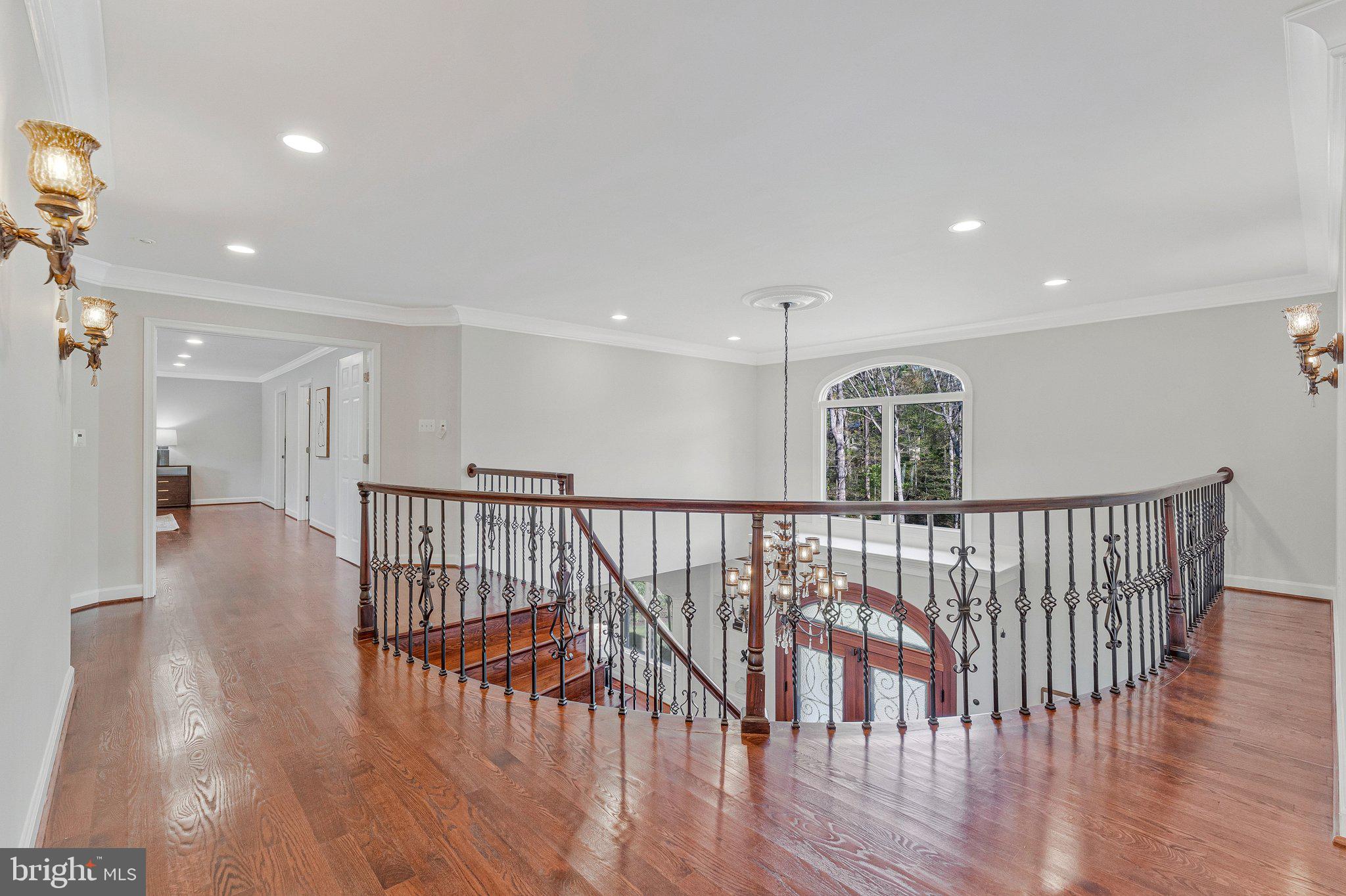 8611 Brook Road McLean, VA 22102 - Photo 44 of 104 a view of staircase with wooden floor and a window