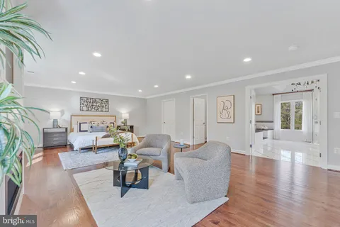 a kitchen with stainless steel appliances granite countertop a stove and a wooden floors