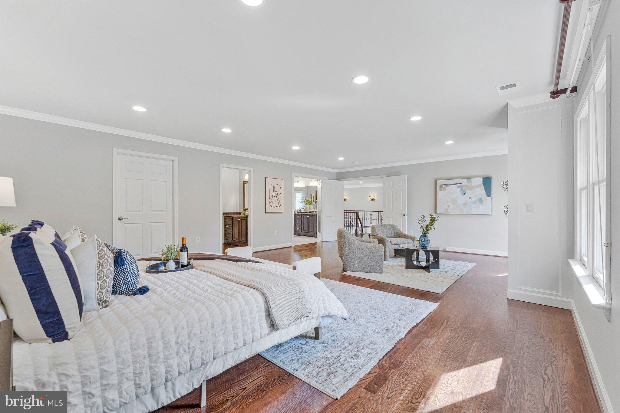 8611 Brook Road McLean, VA 22102 - Photo 48 of 104 a bed room with a bed a couch and a window