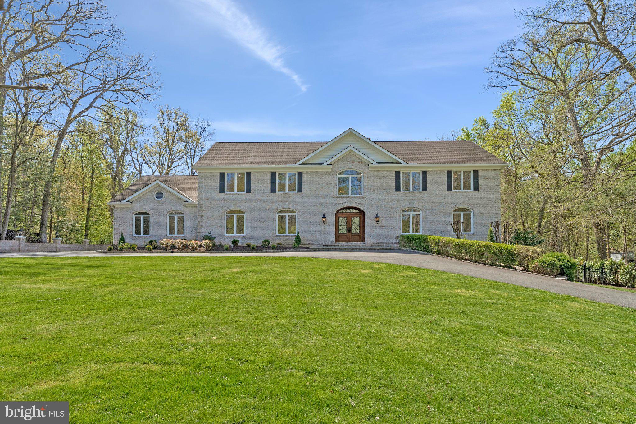 8611 Brook Road McLean, VA 22102 - Photo 5 of 104 a front view of a house with garden