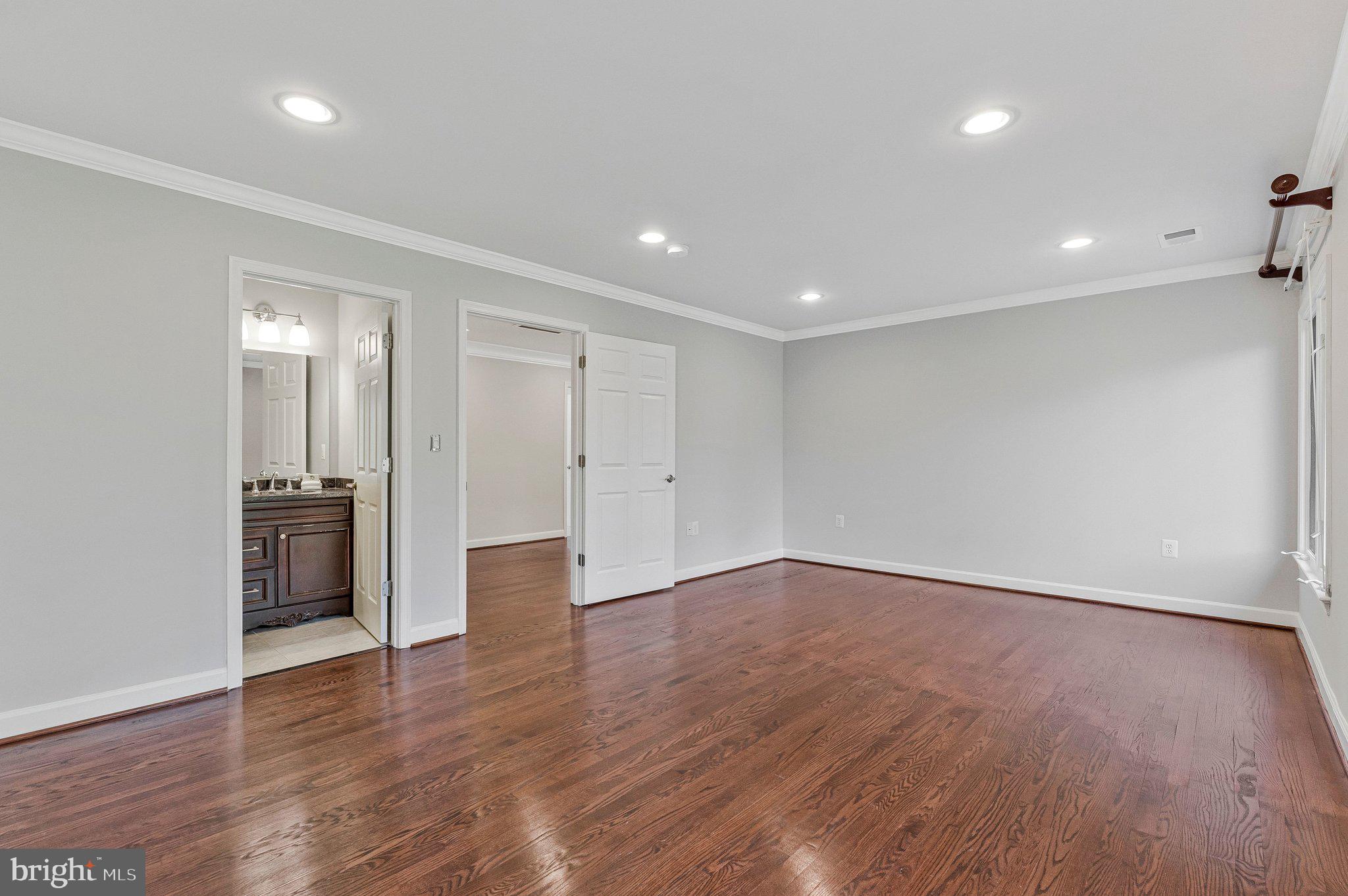 8611 Brook Road McLean, VA 22102 - Photo 62 of 104 a view of an empty room with wooden floor