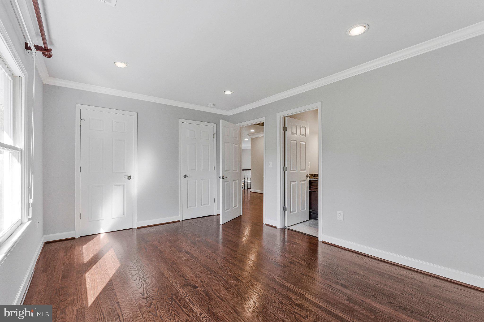 8611 Brook Road McLean, VA 22102 - Photo 65 of 104 a view of an empty room with wooden floor