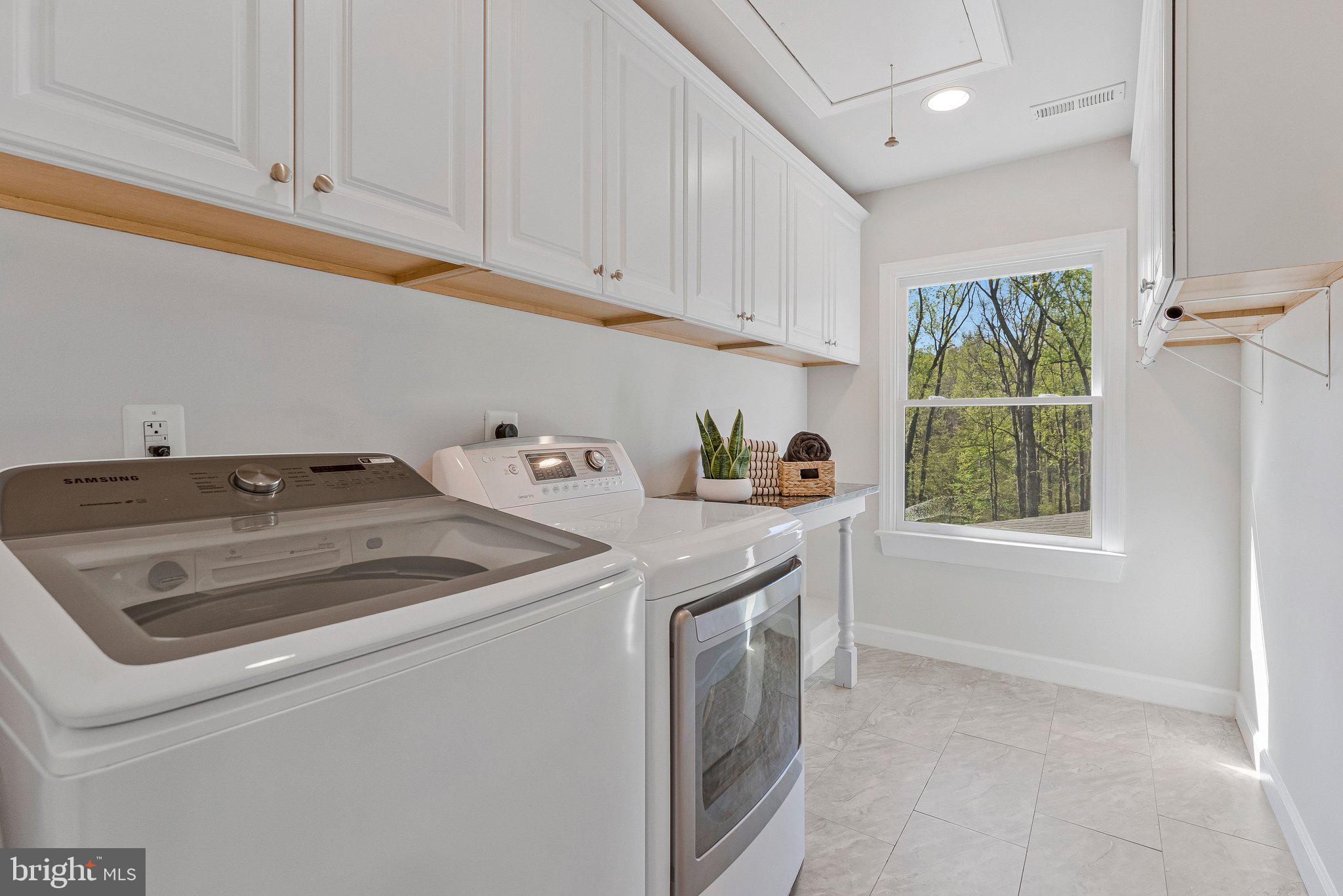 8611 Brook Road McLean, VA 22102 - Photo 73 of 104 a utility room with dryer and washer