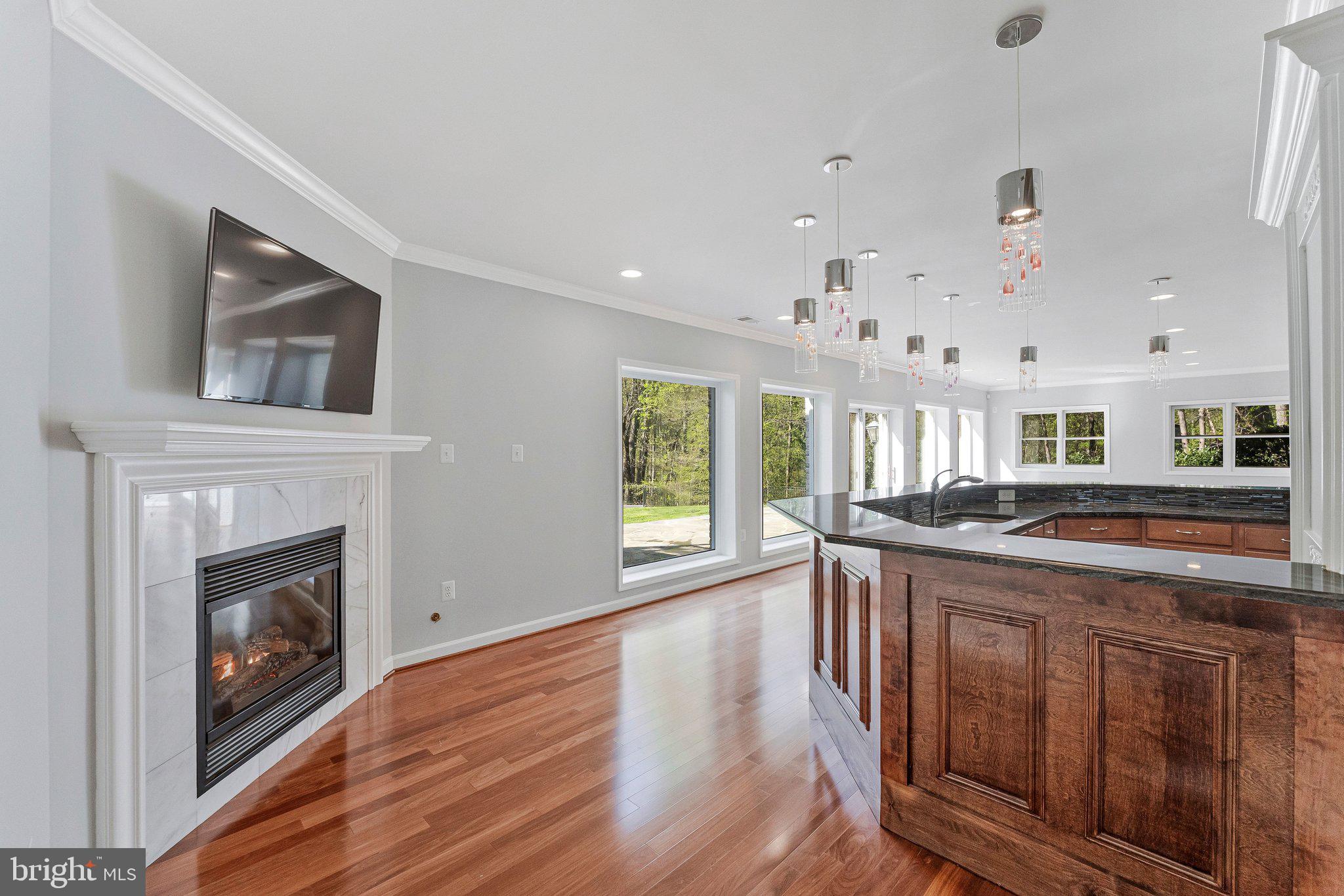 8611 Brook Road McLean, VA 22102 - Photo 74 of 104 a kitchen with stainless steel appliances granite countertop a stove and a wooden floors