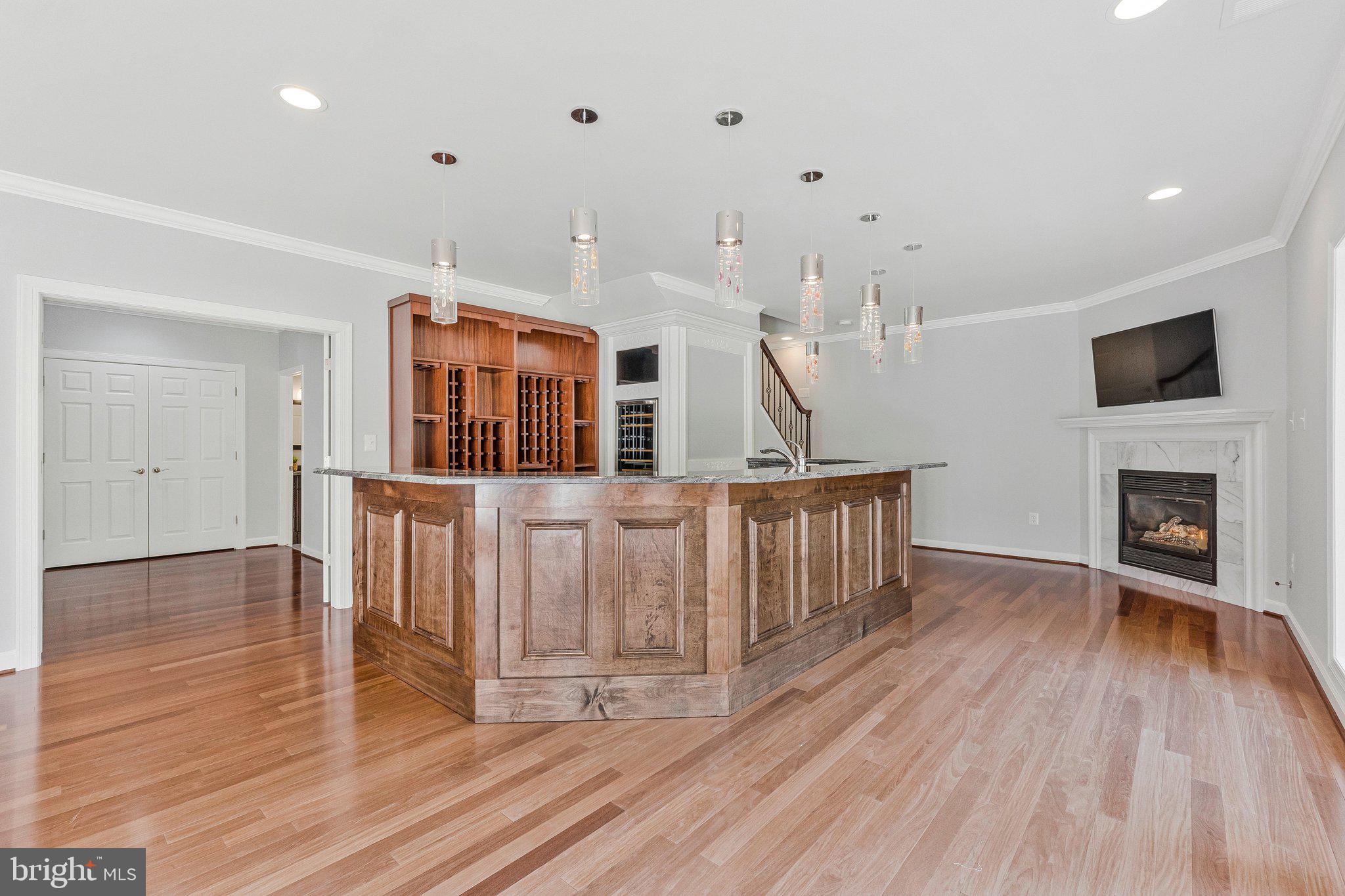 8611 Brook Road McLean, VA 22102 - Photo 77 of 104 a hall with wooden floor and a fireplace