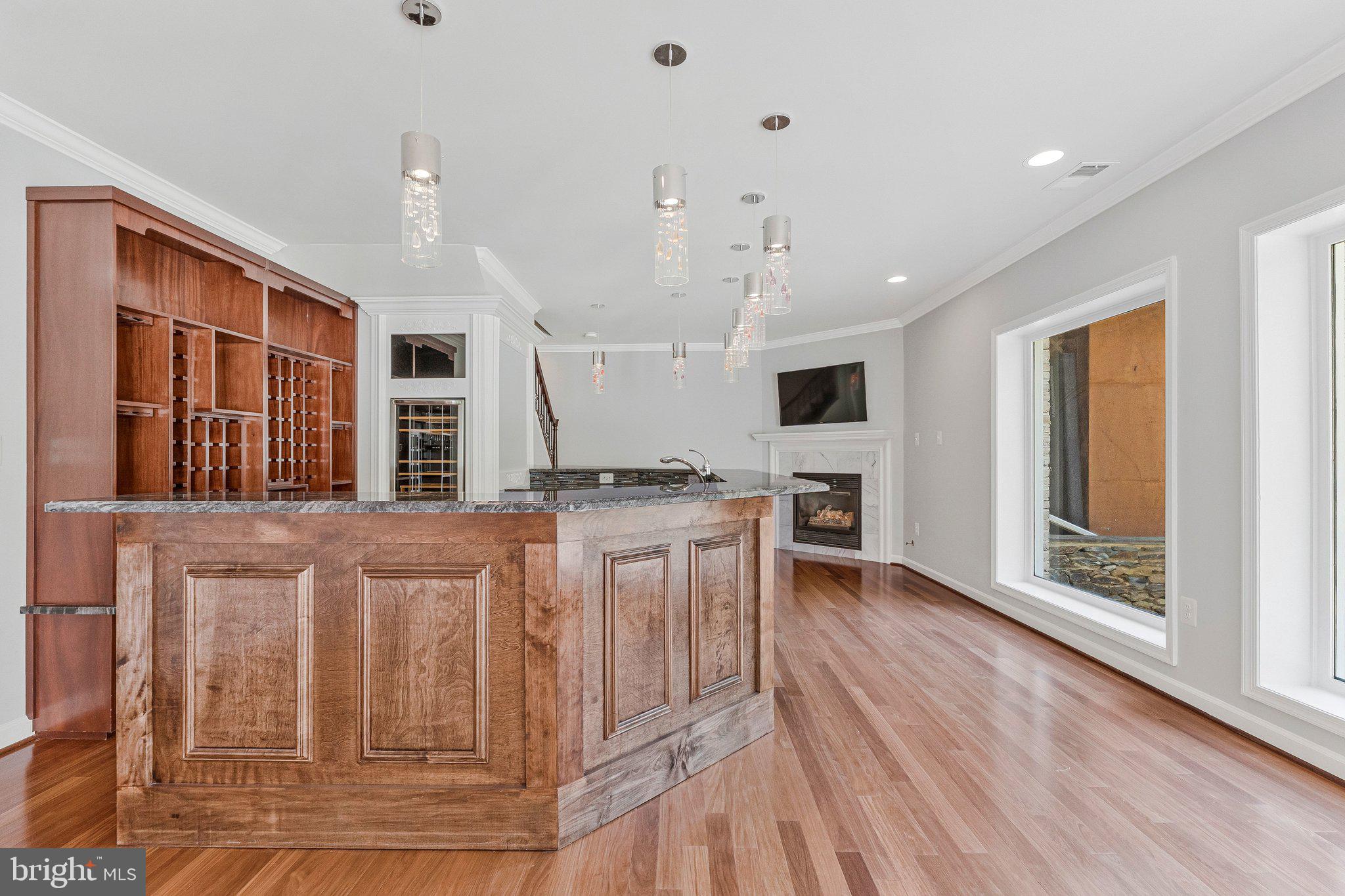 8611 Brook Road McLean, VA 22102 - Photo 78 of 104 a living room with stainless steel appliances kitchen island granite countertop a stove and a sink