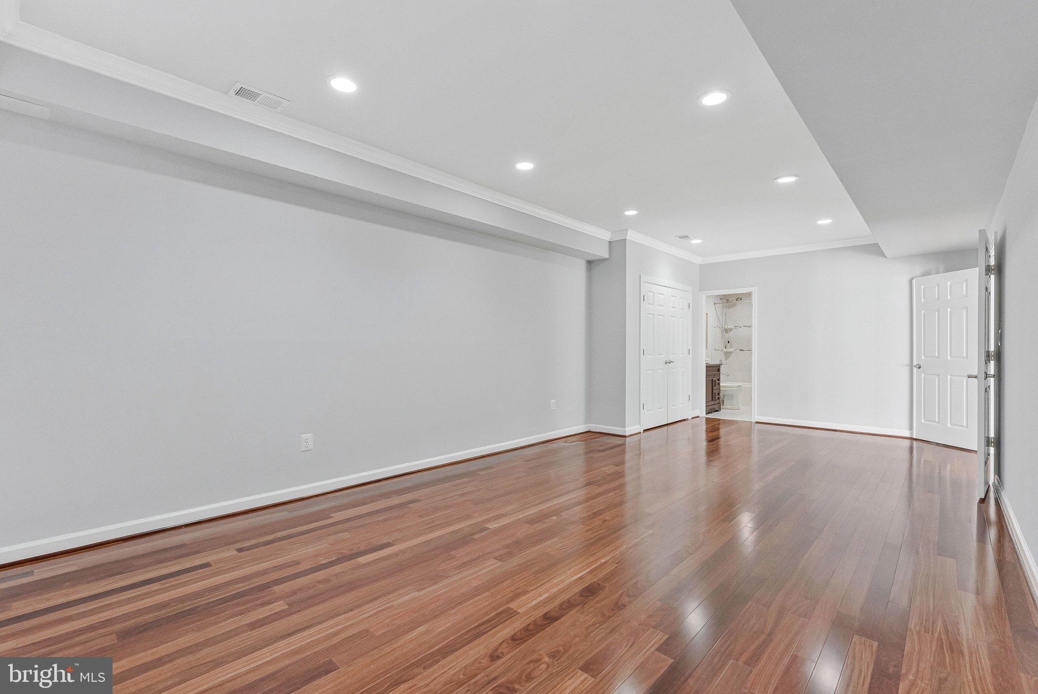 8611 Brook Road McLean, VA 22102 - Photo 84 of 104 a view of an empty room with wooden floor