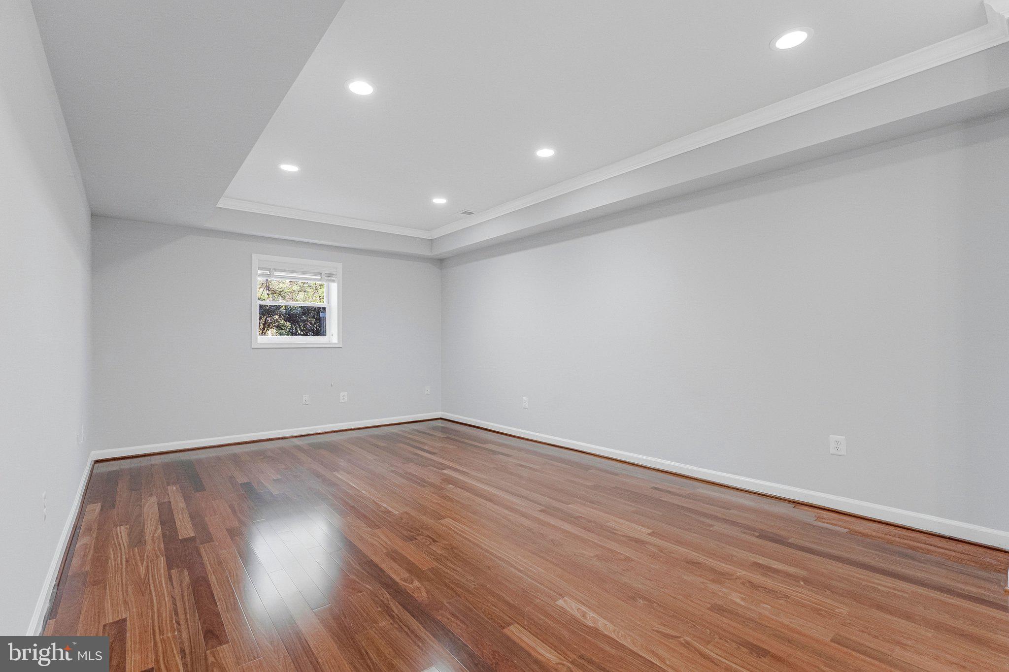 8611 Brook Road McLean, VA 22102 - Photo 85 of 104 a view of an empty room with wooden floor and a window