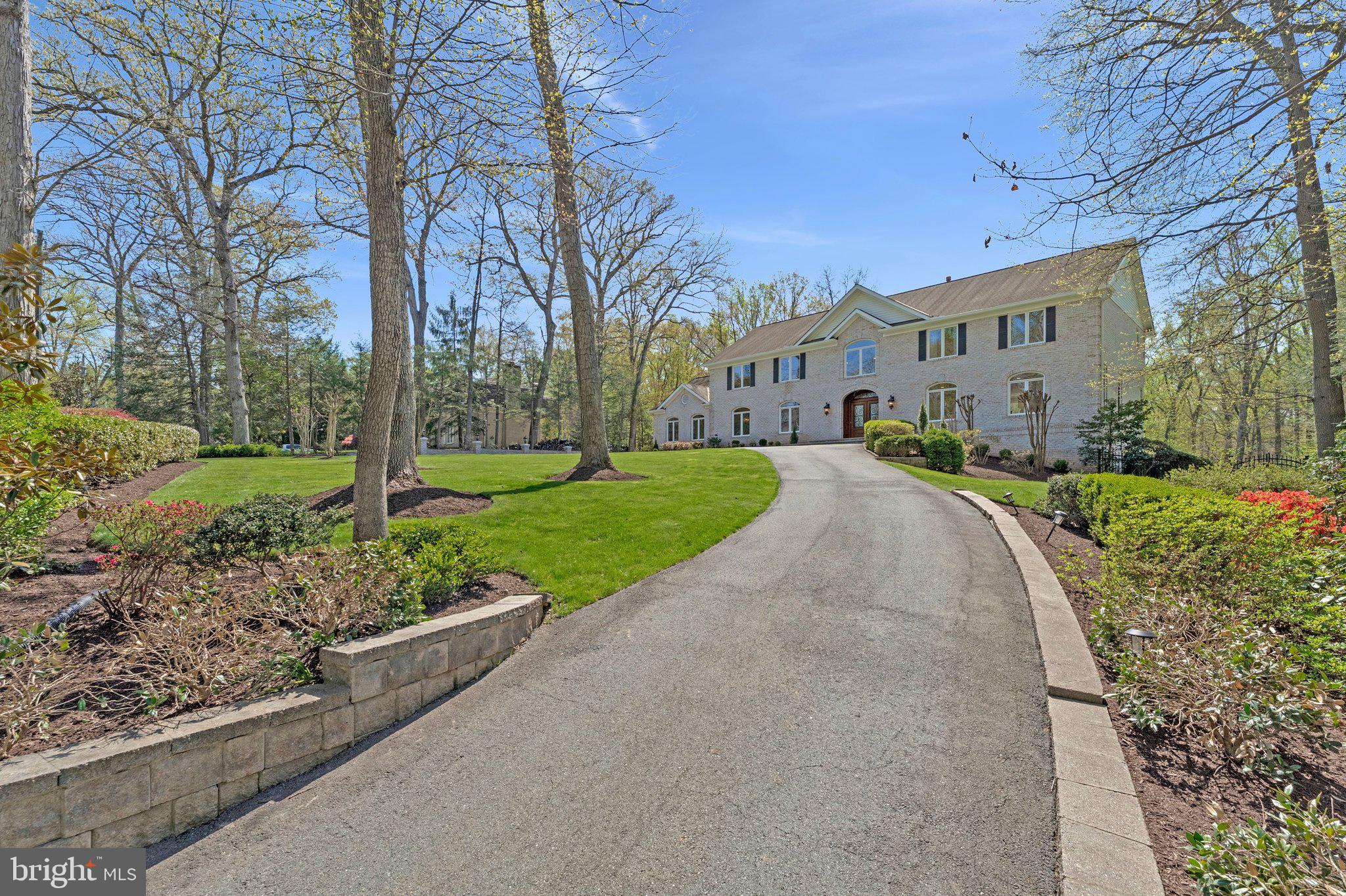 8611 Brook Road McLean, VA 22102 - Photo 9 of 104 a view of a street with a building and trees in the background