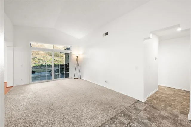 a view of empty room with windows