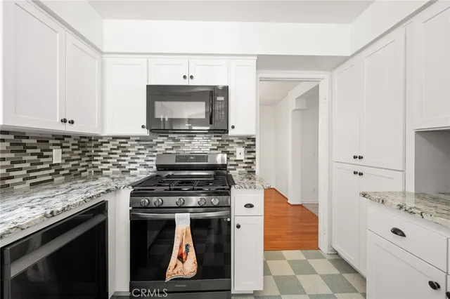 a white refrigerator freezer sitting inside of a kitchen
