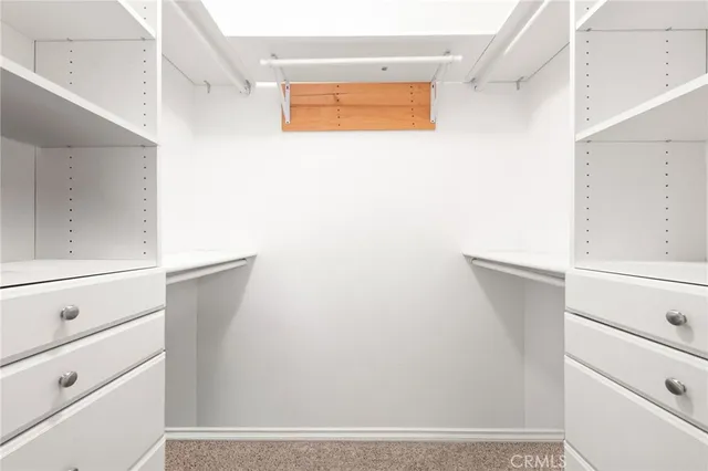 a bathroom with a shower and mirror