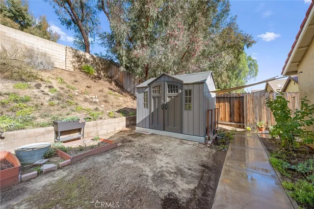 a view of a pathway with a flower plants