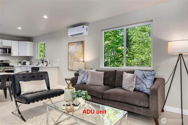 a bedroom with a bed and a couch