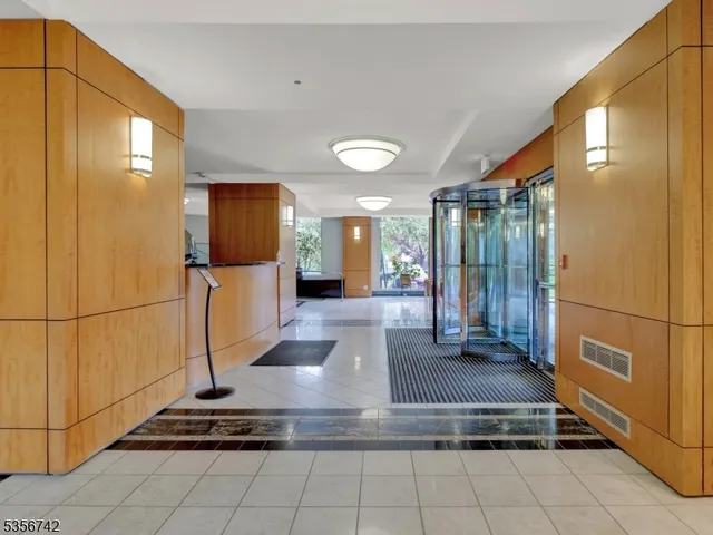 a view of kitchen with furniture and a refrigerator