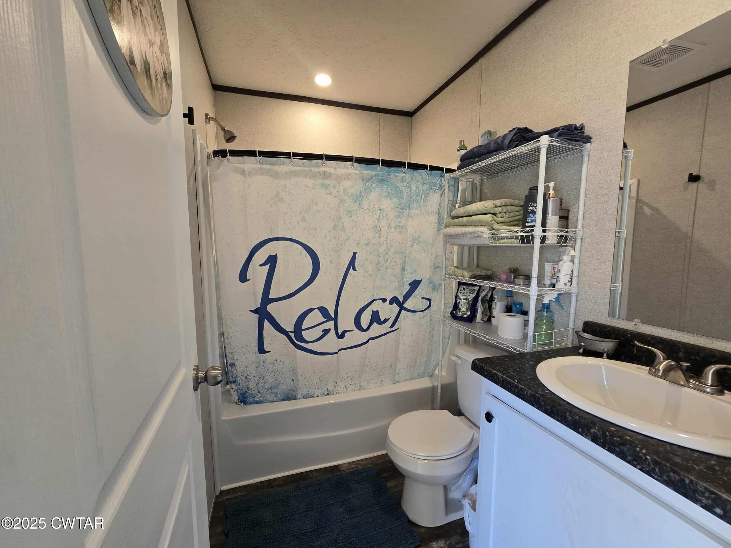 263 Porter Hollow Road Linden, TN 37096 - Photo 11 of 20 a bathroom with a sink a toilet and shower