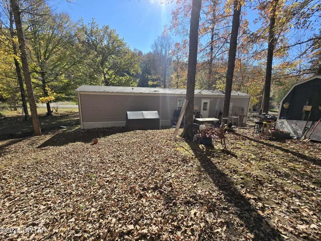 a view of backyard with trees