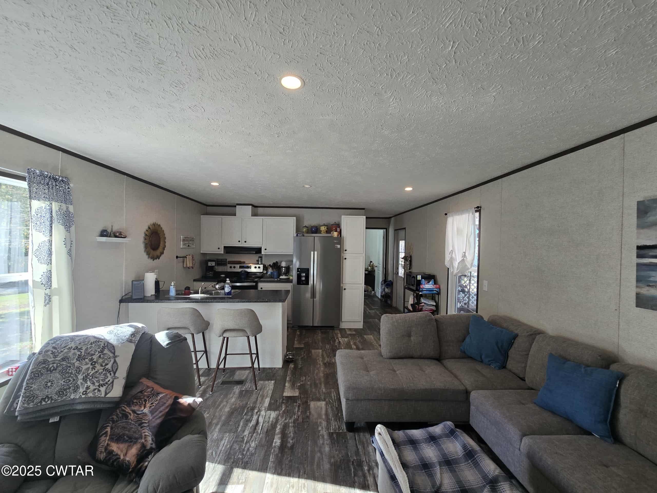 263 Porter Hollow Road Linden, TN 37096 - Photo 2 of 20 a living room with furniture and a large window