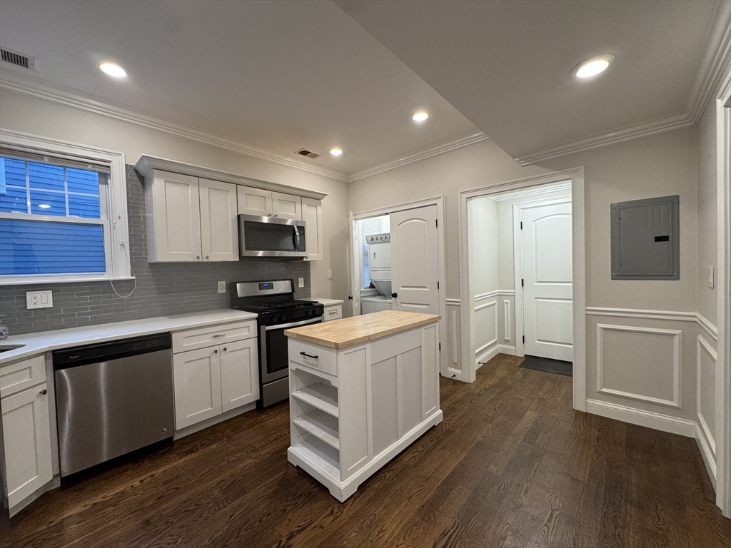 9 Cornwall Street, Unit 1 Boston, MA 02130 - Photo 12 of 22 a kitchen with a stove top oven and refrigerator
