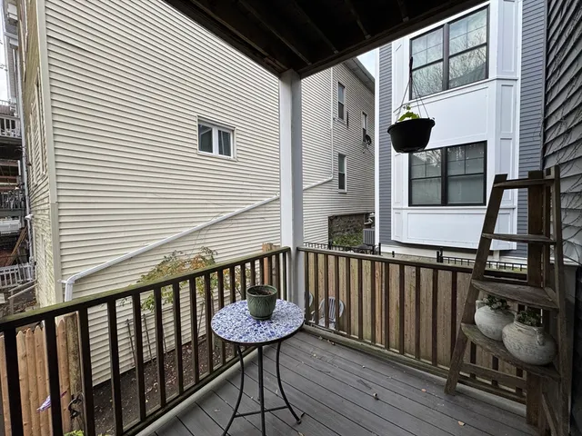 a view of a balcony with furniture