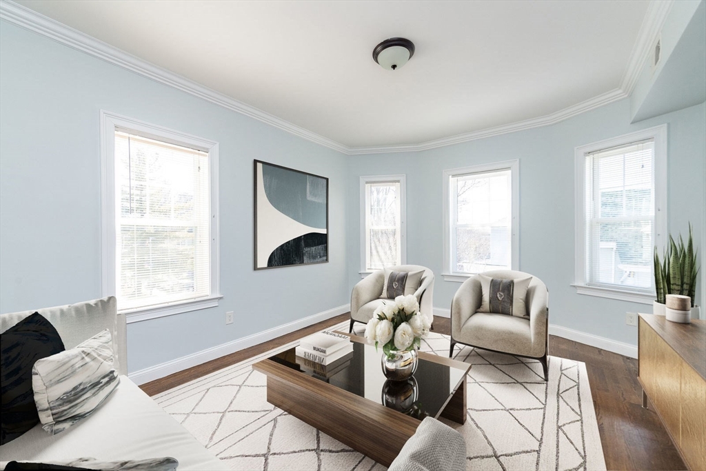 9 Cornwall Street, Unit 1 Boston, MA 02130 - Photo 2 of 22 a living room with furniture and a large window
