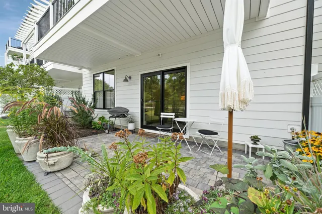 a view of entryway with wooden floor and stairs