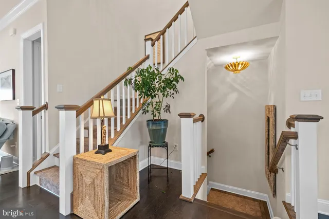 a large kitchen with a table and chairs