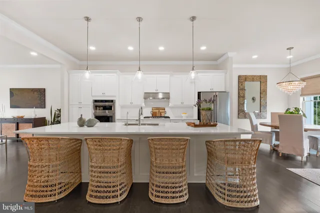 a kitchen with counter top space cabinets and appliances