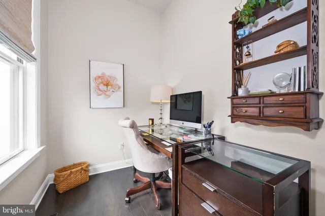a living room with furniture and a dining table with kitchen view