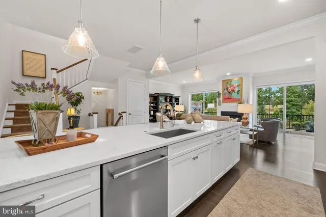 a very nice looking living room with furniture and a large window